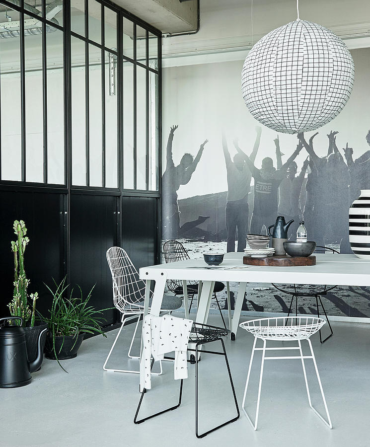 Space Photograph - White Metal Table And Wire Chairs In Black-and-white Dining Area Of Loft Apartment by James Stokes