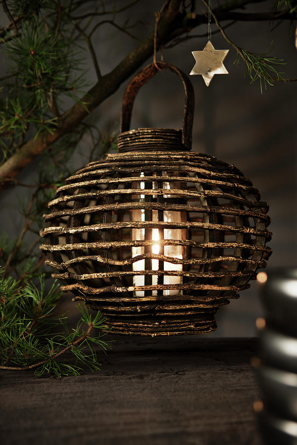 White Pillar Candle In Wooden Candle Lantern Hung From Pine Branch Photograph by Lykke Foged & Morten Holtum