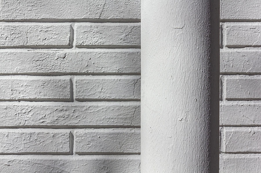 White Pipe and White Brick Wall Photograph by Robert Ullmann