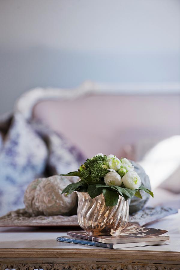 White Ranunculus In Silver Pot On Coffee Table Photograph by Christophe Madamour