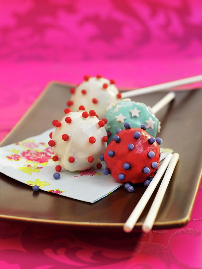 White, Red And Blue Cake Pops With Stars And Balls Photograph by Garlick, Ian