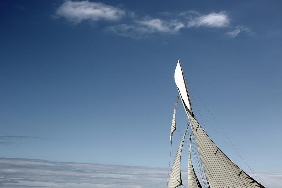 White Sail Against Blue Sky Photograph by Gary John Norman