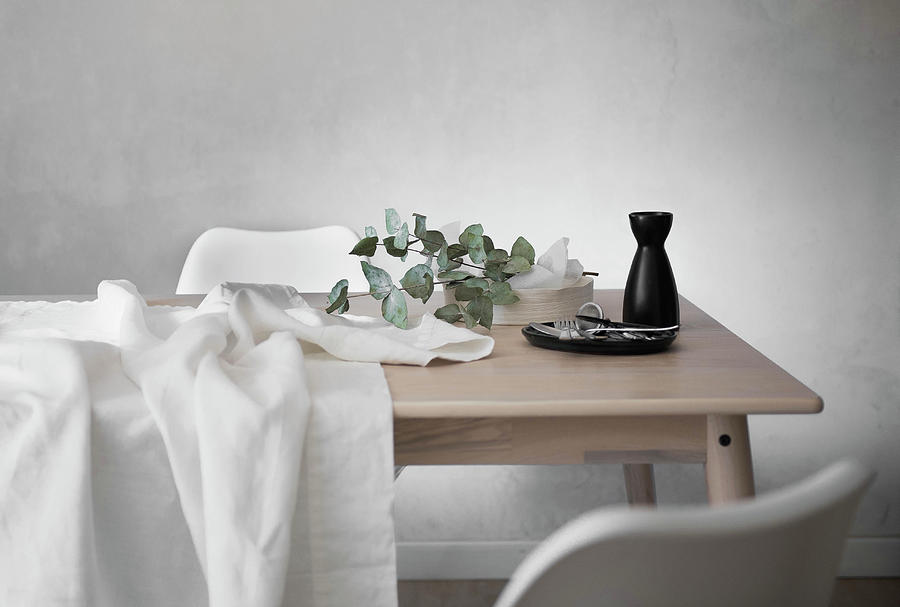 White Tablecloth, Cutlery, Carafe And Eucalyptus Branch On Table Photograph by Agata Dimmich