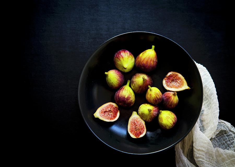 Whole And Cut Fresh Figs In A Black Bowl Photograph by Lisa Rees