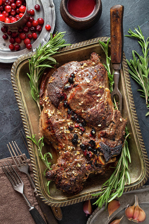 Whole Baked Beef With Cranberry Sauce And Garlic Above Photograph by Andrey Maslakov