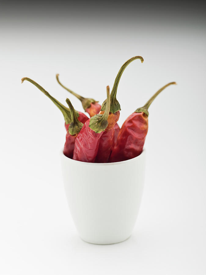 Whole Dried Red Chilies In A Cup Photograph by Tobias Titz