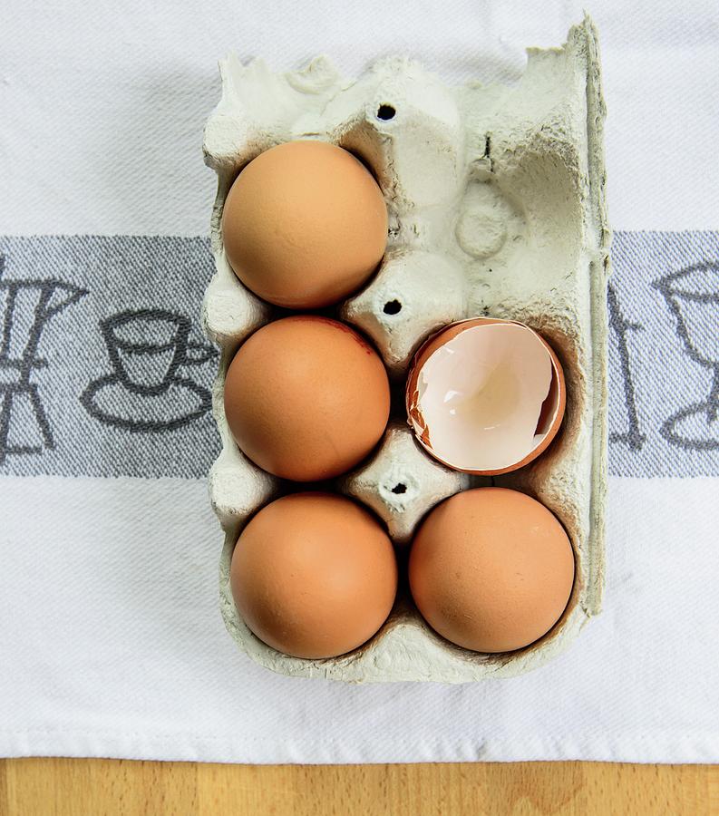 Whole Eggs And Egg Shells In An Egg Box Photograph by Katrin Benary ...