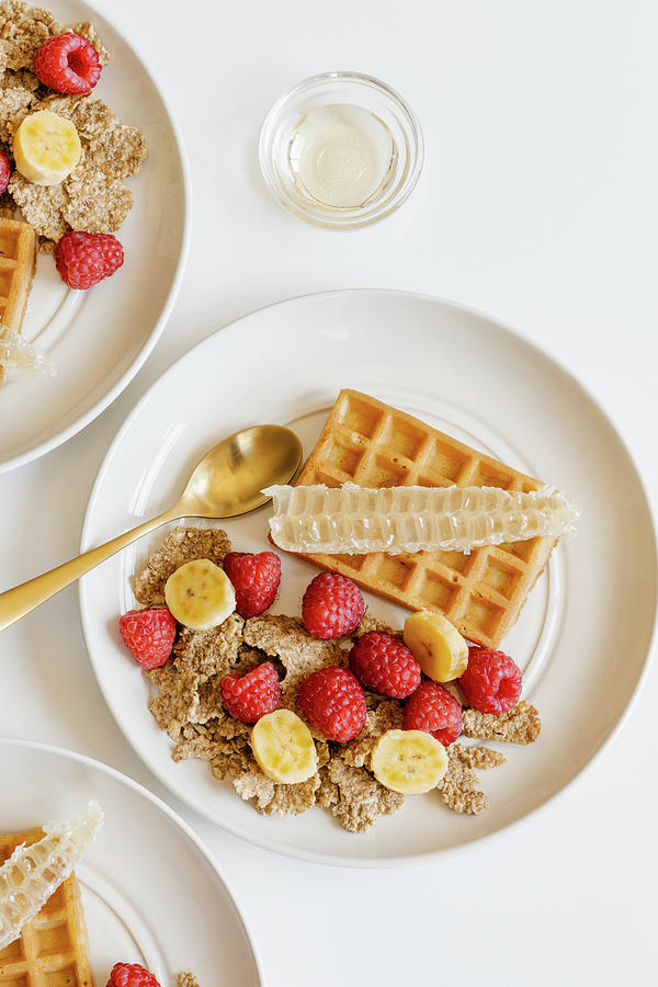 Whole Graine Cereal With Fresh Raspberries And Banana, Waffles And Honeycombs Photograph by Alla Machutt