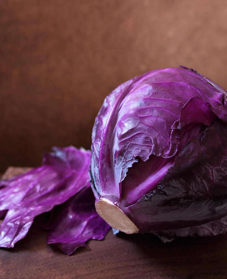 Whole Head Of Purple Cabbage On Wooden Cutting Board Photograph by Katharine Pollak