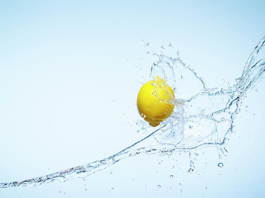 Whole Lemon And A Water Splash Photograph by Chris Stein