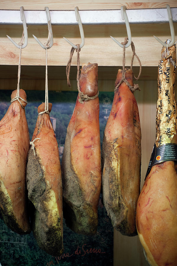 Whole Parma Hams Hanging On Hooks Photograph by Jalag / Francesca Moscheni