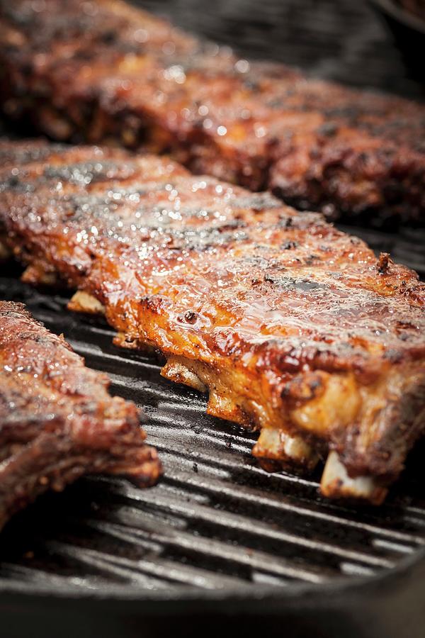 Whole Rack Of Pork Ribs On Grill With Barbecue Sauce Photograph by Eising Studio