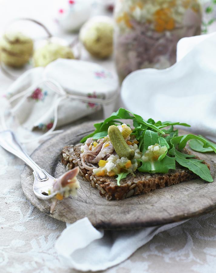 Wholemeal Bread Topped With Pickled Fish And Gherkins Photograph by Mikkel Adsbl