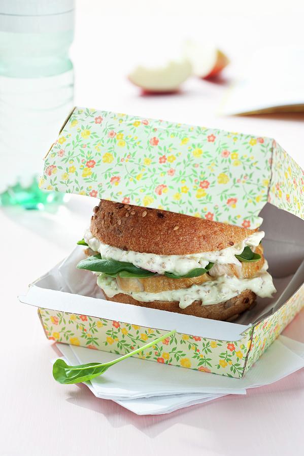Wholemeal Burger Bun Filled With Apple Quark, Chicken Breast And Spinach Photograph by Gerlach, Hans