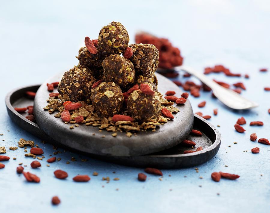 Wholemeal Muesli Balls With Dried Goji Berries Photograph by Mikkel Adsbl