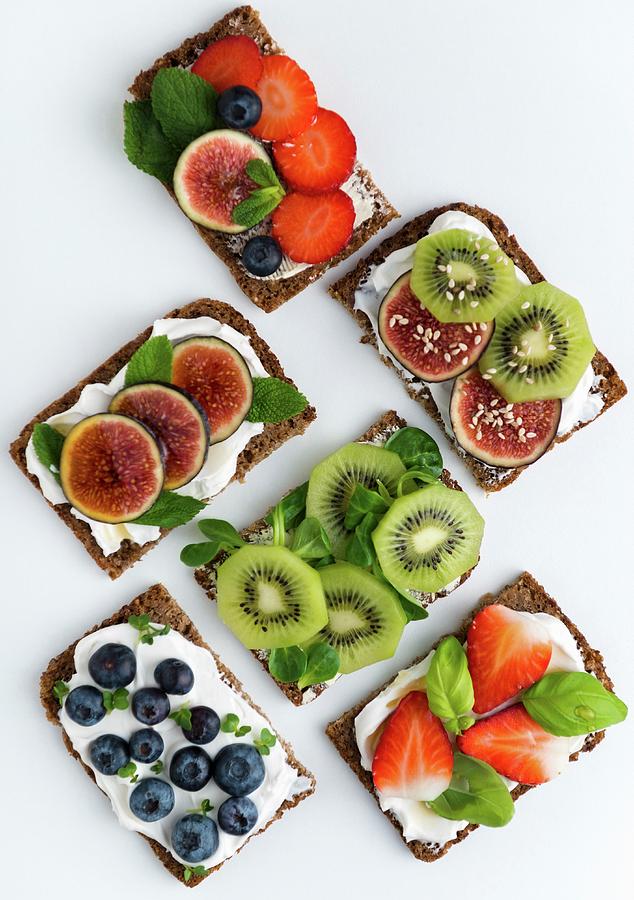 Wholemeal Open Sandwiches Topped With Soya Quark And Various Fruits Photograph by Komar