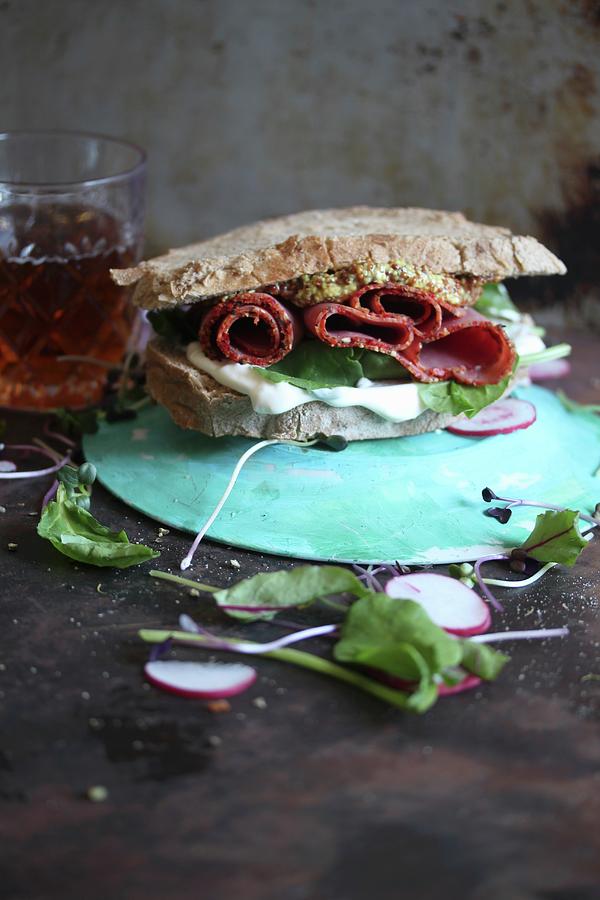 Wholemeal Sandwich With Salami, Lettuce, Remoulade And Mustard Photograph by Milly Kay