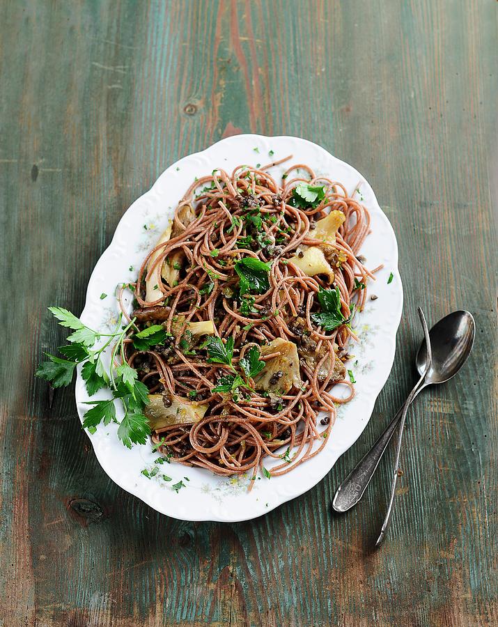 Wholemeal Spaghetti With Beluga Lentils And Fried Oyster Mushrooms Photograph by Ewgenija Schall