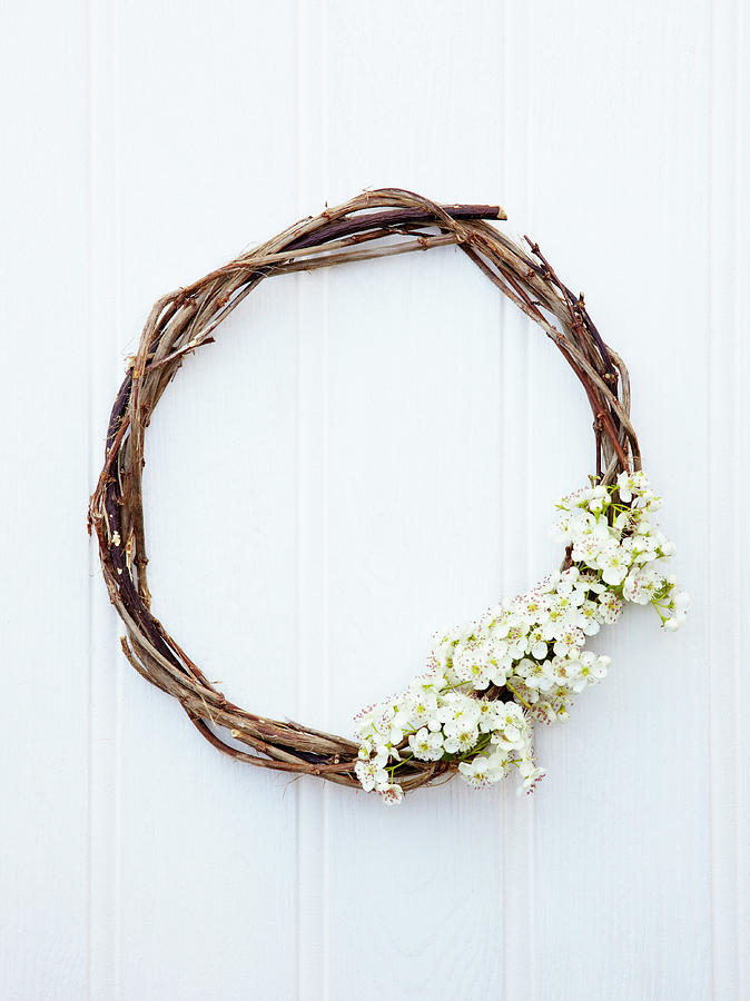 Wicker Wreath Decorated With Spring Flowers Photograph by Simon Scarboro