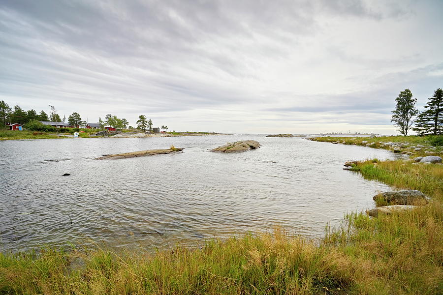 Wide Angle Photograph Of An Ocean Bay With Grassy Shore On A Cloudy Day Photograph