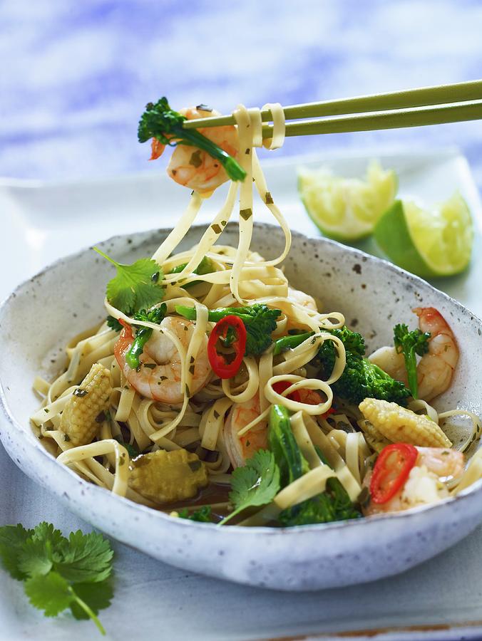 Wide Noodles With King Prawns And Broccoli thailand Photograph by Clive ...