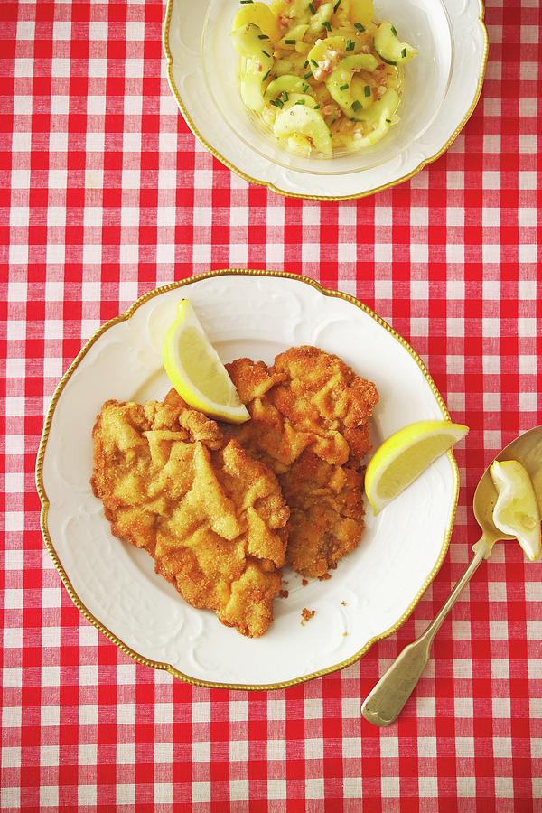 Wiener Schnitzel breaded Veal Escalope With Potato Salad Photograph by Michael Wissing