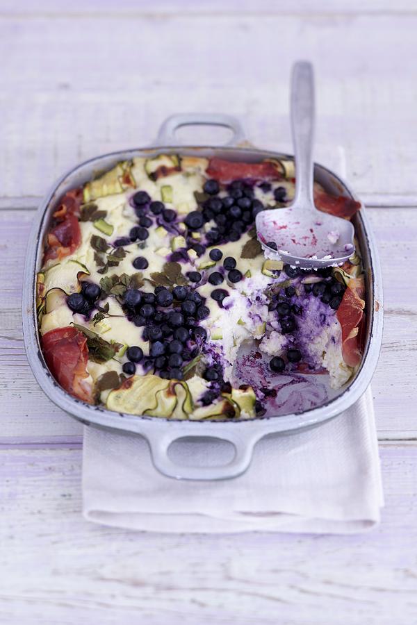 Wild Blueberry And Feta Bake With Bacon In An Ovenproof Dish Photograph by Anke Schtz
