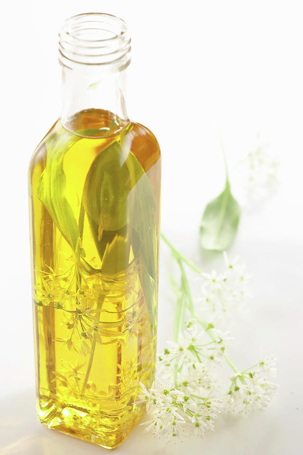 Wild Garlic Oil With Fresh Leaves Photograph by Teubner Foodfoto
