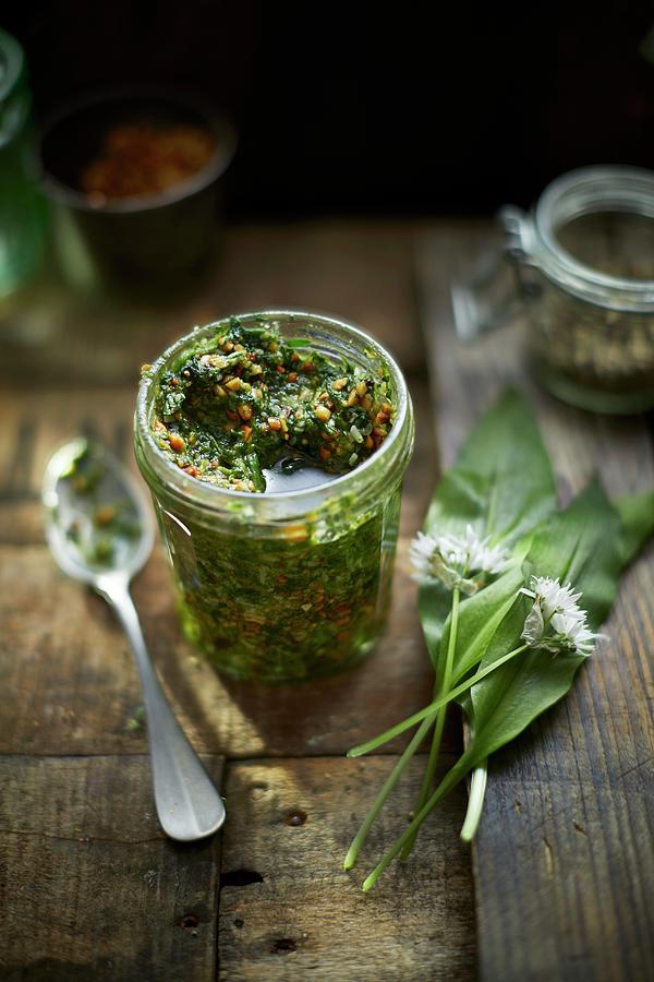 Wild Garlic Pesto On Wood In A Jar Photograph by Tom Regester