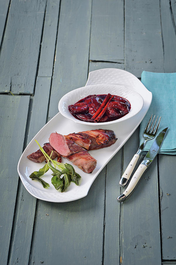 Wild Hare Fillets Wrapped In Bacon With Balsamic Damsons Photograph by Tre Torri