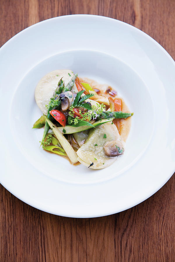 Wild Herb Ravioli With Glazed Spring Vegetables Photograph by Michael Wissing
