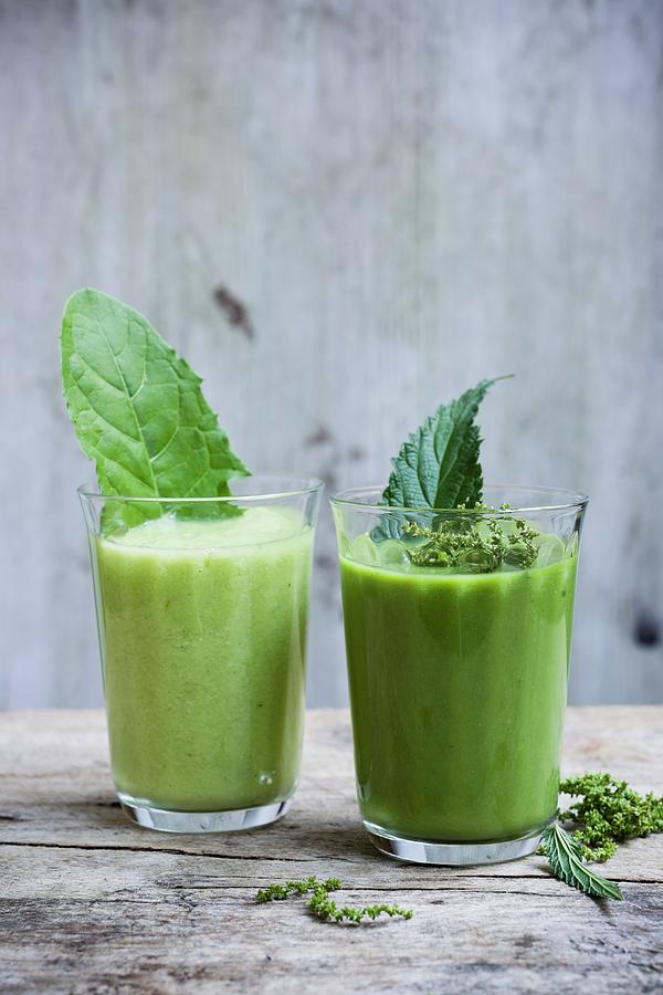 Wild Herb Smoothies With Stinging Nettles And Dandelions Photograph by Brigitte Sporrer