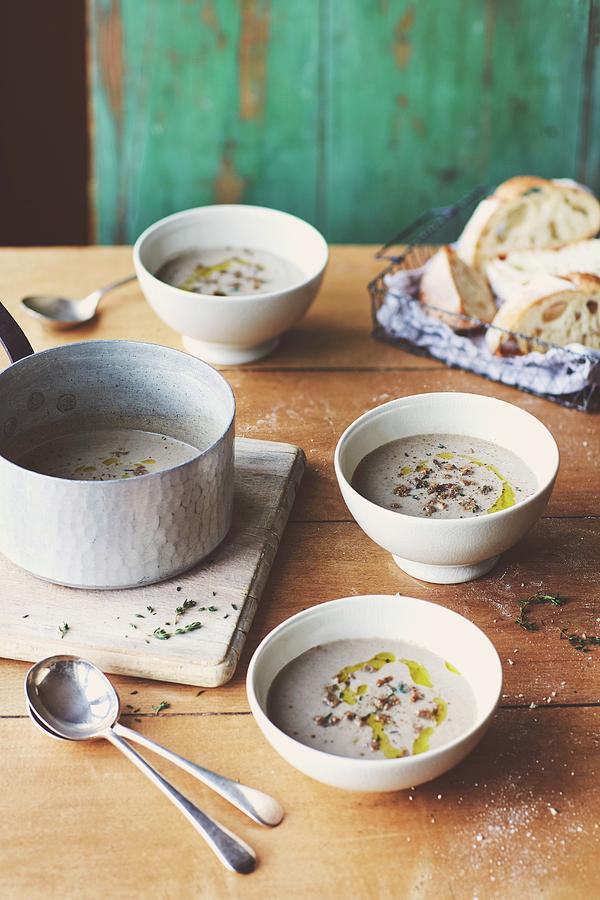 Wild Mushroom Soup With Fresh Thyme And Crusty Sourdough Bread Photograph by Lukejalbert