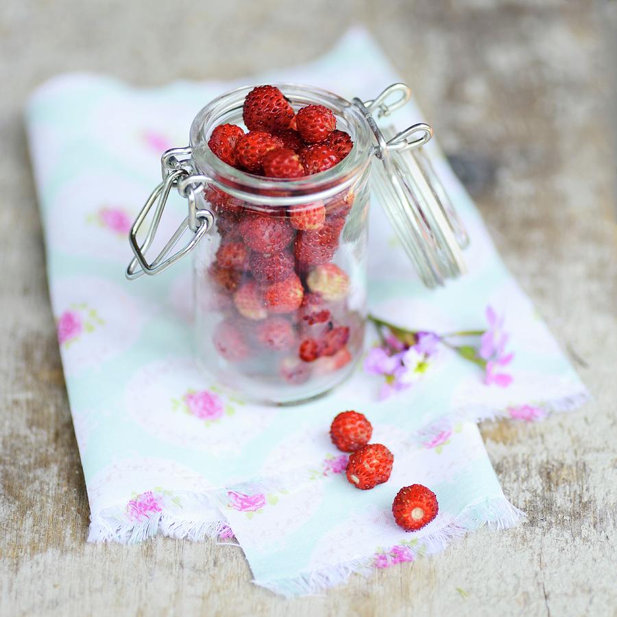 Wild Strawberries In A Preserving Jar Photograph by Sonia Chatelain