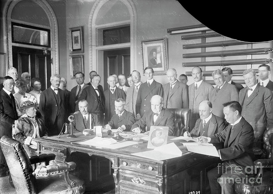 William J. Bryan Signing Treaties Photograph by Bettmann
