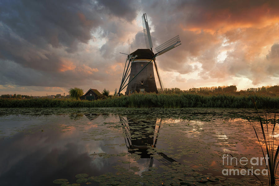 Sunset Photograph - Windmill under an explosive sky at sunset by IPics Photography Sunset Photograph - Windmill under an explosive sky at sunset by IPics Photography