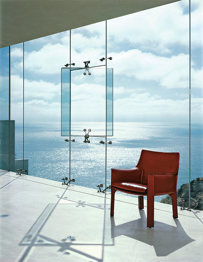 Window In A Glass Wall With Red Chair Photograph by Erhard Pfeiffer