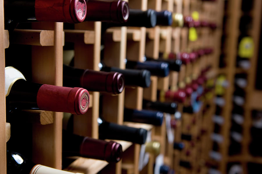 Wine Bottles In Cellar Photograph by Markhatfield
