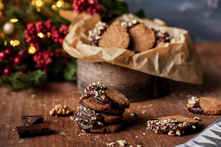 Winter Cookies With Walnuts Dipped In Melted Chocolate Photograph by Natasa Dangubic