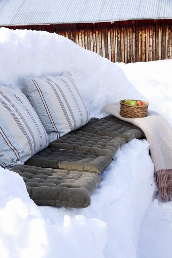 Winter Picnic On Bench Carved Out Of Snow Photograph by Susanna Rosn