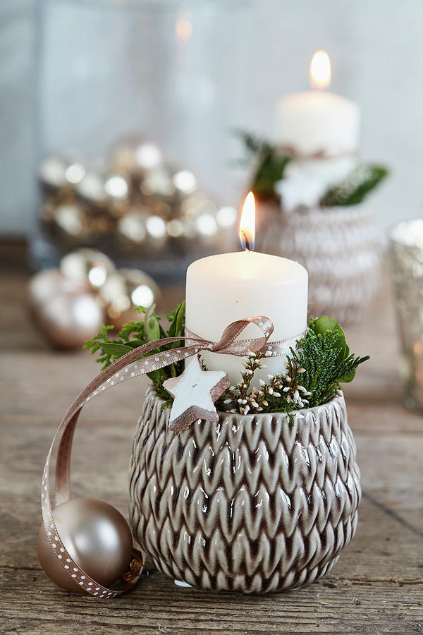 Wintry Arrangement Of Candle And Dried Flowers In Flower Pot With Structured Surface Photograph by Brigitte Sporrer