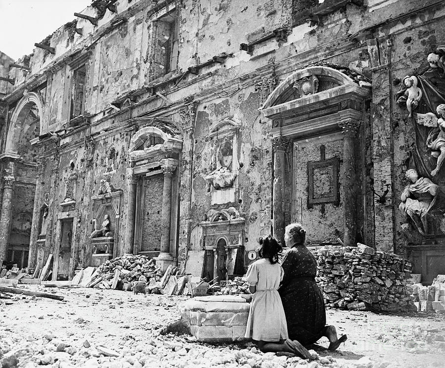 Woman & Girl Kneeling At Ruined Church Photograph by Bettmann