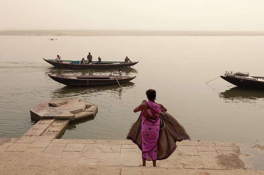Woman And Boats By The Ganges River In Photograph by Marji Lang
