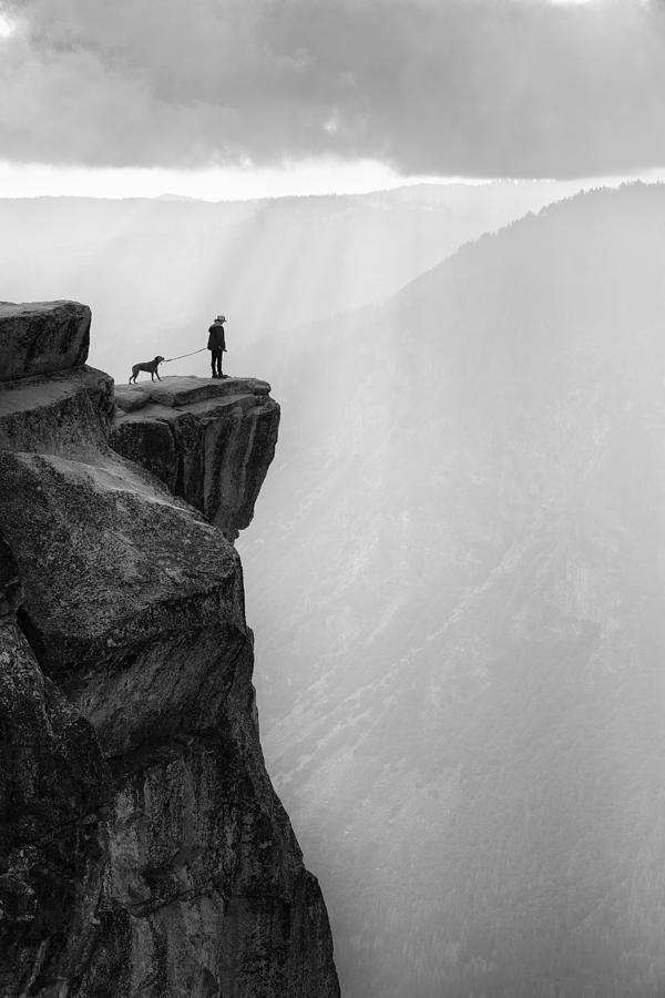 Yosemite National Park Photograph - Woman And Dog On Cliff by Aidong Ning