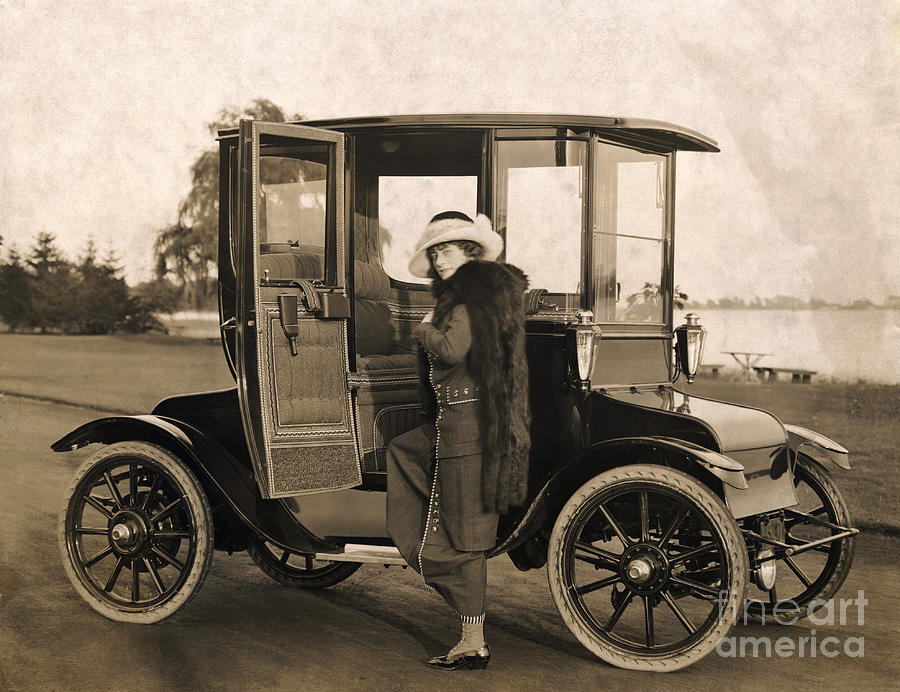 Woman And Electric Car Photograph by Bettmann