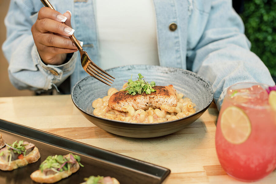 Woman At A Table Eating Salmon And Back And Cheese Photograph by Cavan Images / Holly D Photography - Fine Art America Woman At A... 