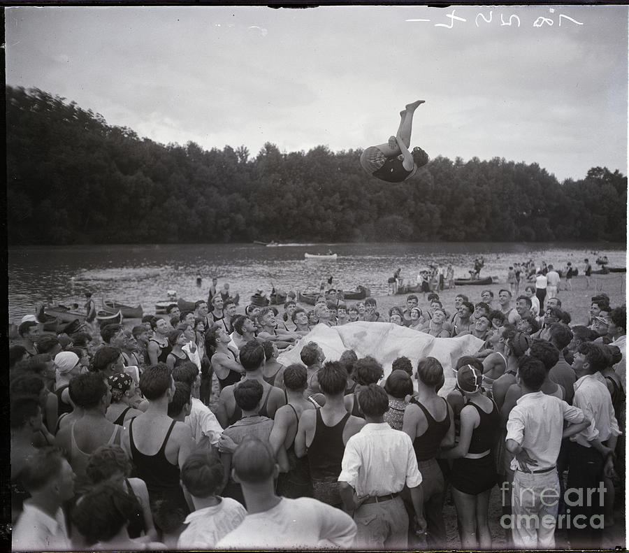 Woman Being Tossed In Air On Blanket Photograph by Bettmann