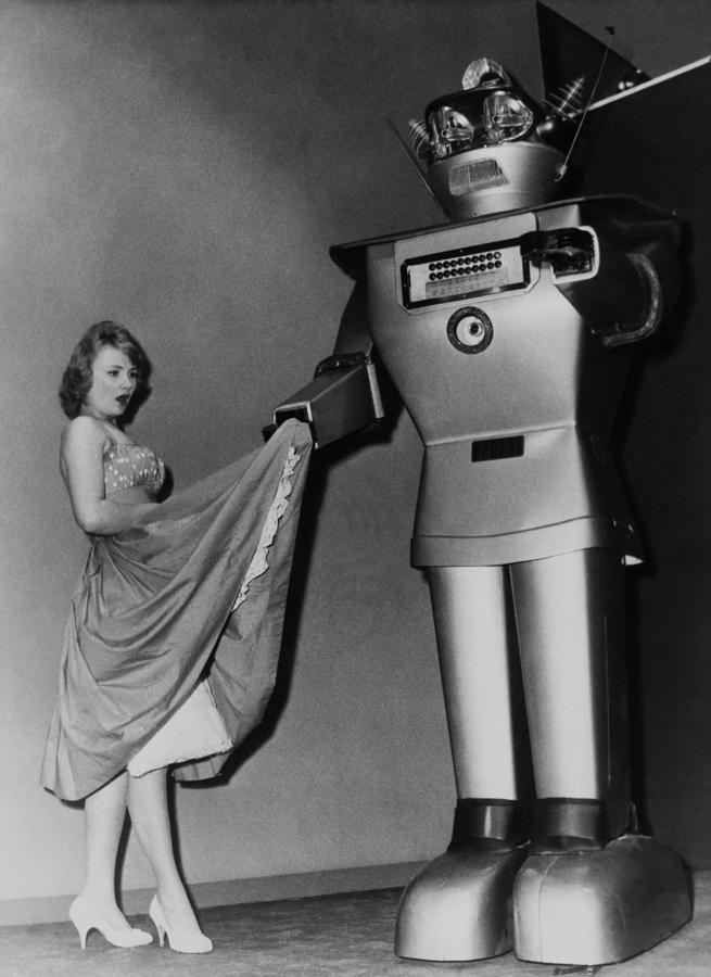 Woman Beside A Robot Photograph by Keystone-france