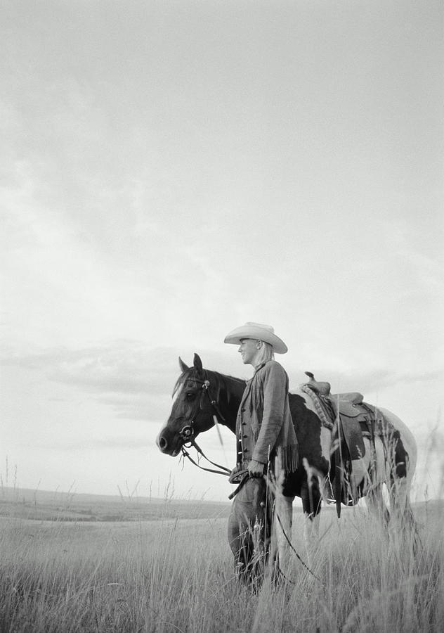 Woman Beside Horse On Prairie, Wyoming Photograph by Caroline Wood
