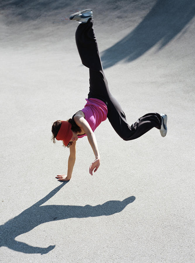 Woman Breakdancing Outdoors by Buero Monaco